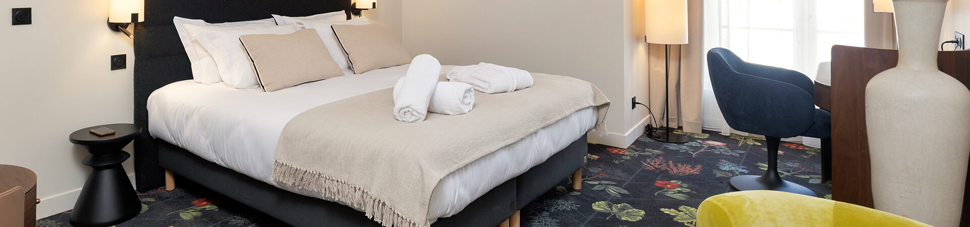 High-end stay at Hôtel Les Coulisses du Théâtre in Saint-Quentin, featuring 32 elegant and air-conditioned rooms in a refined setting