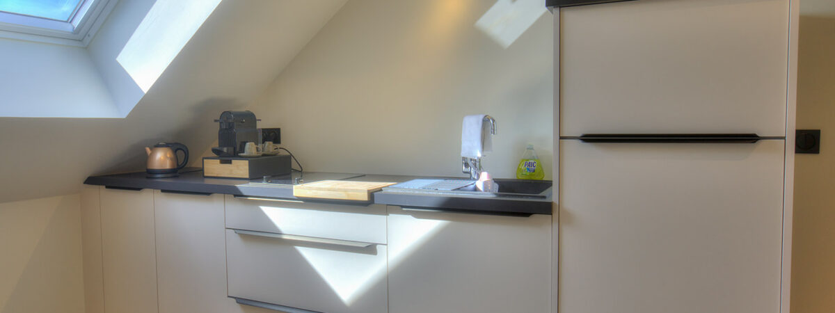 Modern fully equipped kitchen in a tourist apartment in Saint-Quentin